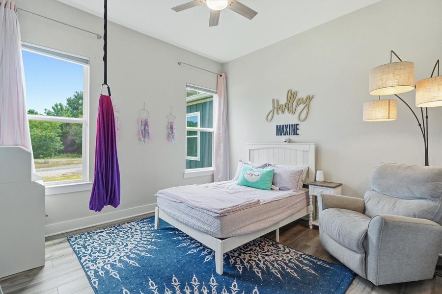 Third bedroom with high ceilings and two windows overlooking side yard and garage Third bedroom with high ceilings and two windows overlooking side yard and garage