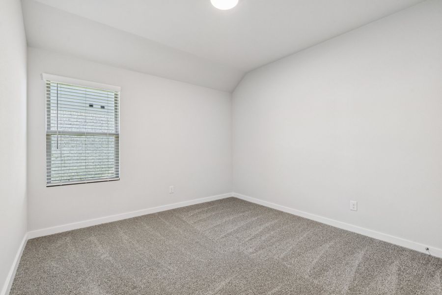 Bedroom in the Oscar home plan by Trophy Signature Homes – REPRESENTATIVE PHOTO