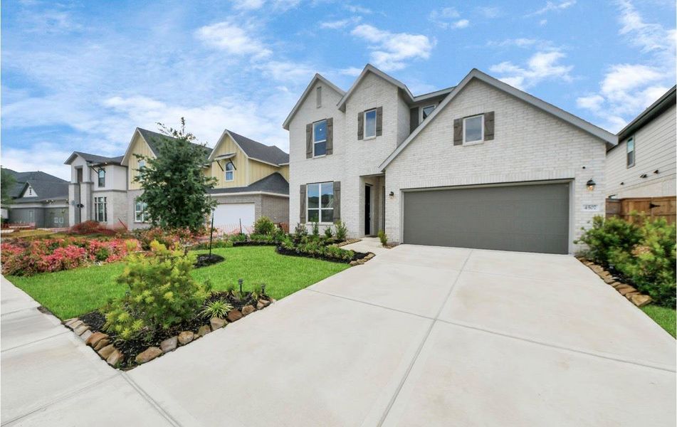 Front exterior of a new home in Cross Creek West: Richmond Collection, Fulshear, TX, highlighting curb appeal (Image 2).