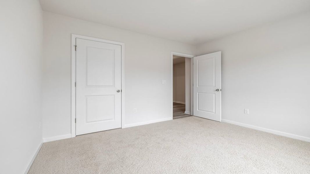 Spacious, unfurnished interior of a new home in Bentley Park, Greenwood (Image 15).