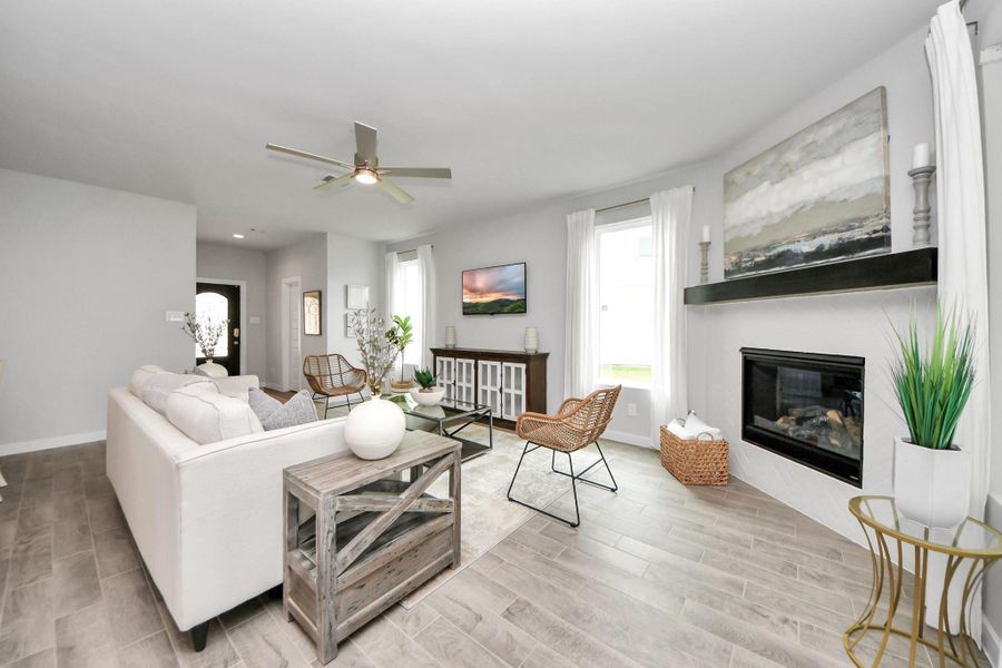Take another glimpse into the heart of the home with this additional view of the family room—a sprawling space ready to accommodate all your gatherings. Sample photo of completed home with similar floor plan. Actual colors and selections may vary.