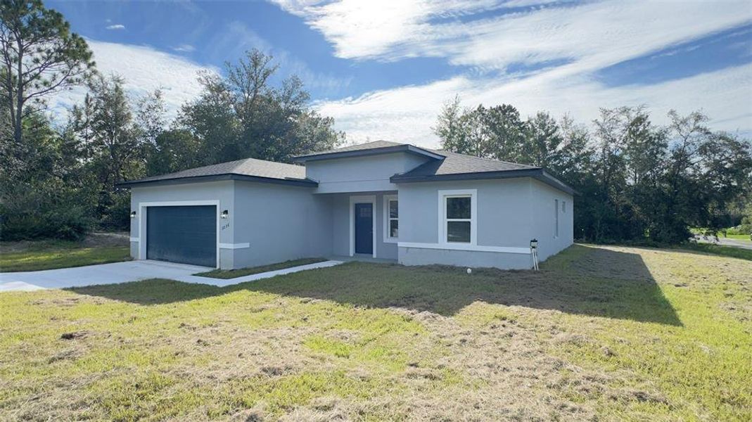 Front exterior of a new home in , Dunnellon, FL, highlighting curb appeal (Image 17).