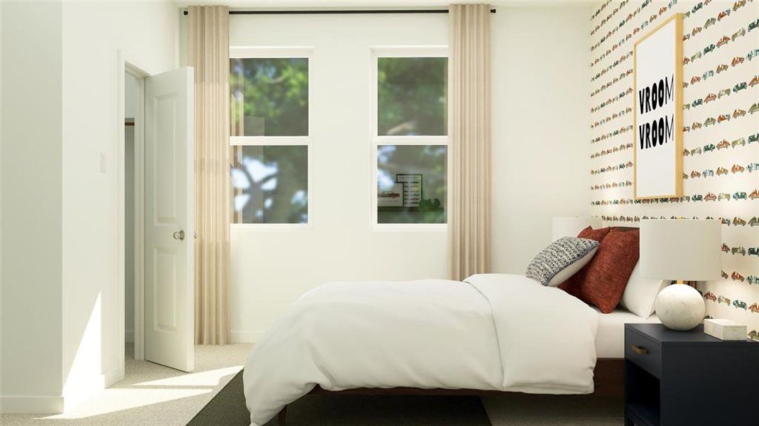 Bedroom featuring carpet floors and baseboards