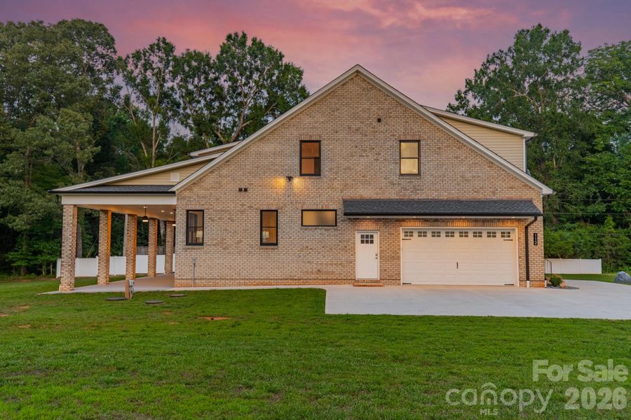 Front exterior of a new home in , Wesley Chapel, NC, highlighting curb appeal (Image 2). Front exterior of a new home in , Wesley Chapel, NC, highlighting curb appeal (Image 2).