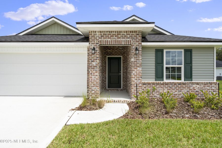 Front exterior of a new home in Summerglen, Jacksonville, FL, highlighting curb appeal (Image 1). Front exterior of a new home in Summerglen, Jacksonville, FL, highlighting curb appeal (Image 1).