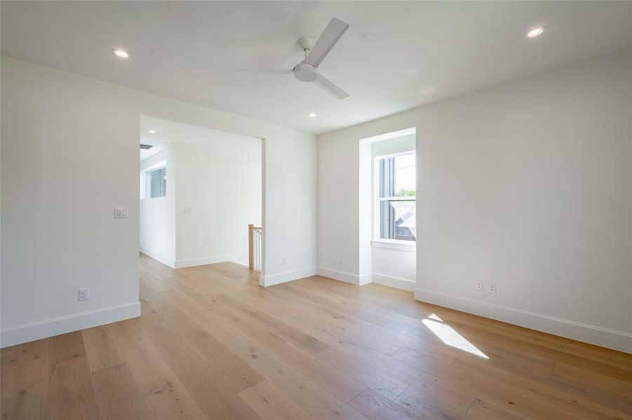 Spare room featuring light hardwood / wood-style flooring and ceiling fan