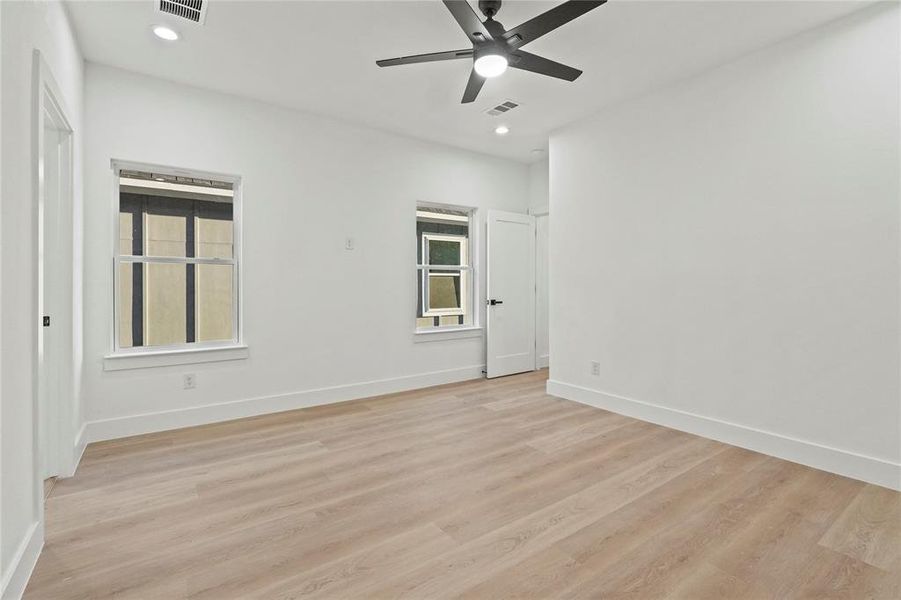 Spare room with light wood-style flooring, recessed lighting, and a ceiling fan Spare room with light wood-style flooring, recessed lighting, and a ceiling fan