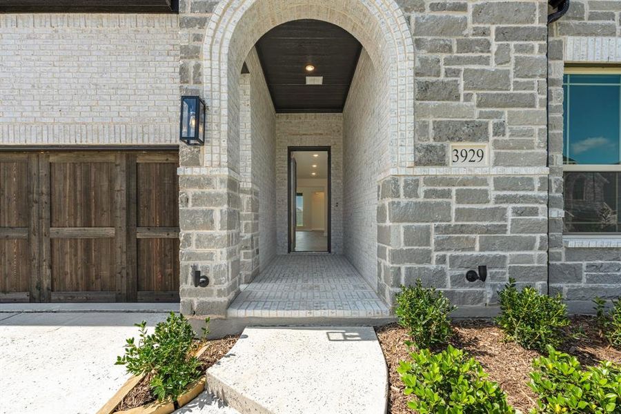 Front exterior of a new home in Painted Tree Woodland District 50, McKinney, TX, highlighting curb appeal (Image 1). Front exterior of a new home in Painted Tree Woodland District 50, McKinney, TX, highlighting curb appeal (Image 1).