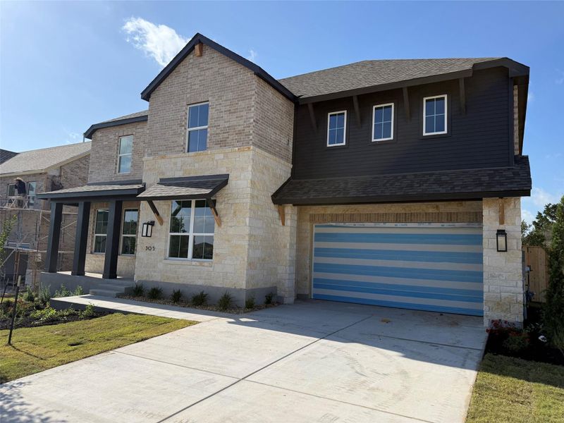 Front exterior of a new home in Lariat, Liberty Hill, TX, highlighting curb appeal (Image 1). Front exterior of a new home in Lariat, Liberty Hill, TX, highlighting curb appeal (Image 1).