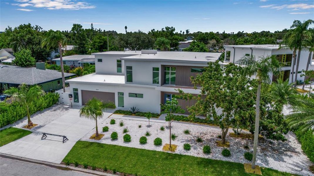 Front exterior of a new home in , Sarasota, FL, highlighting curb appeal (Image 24).