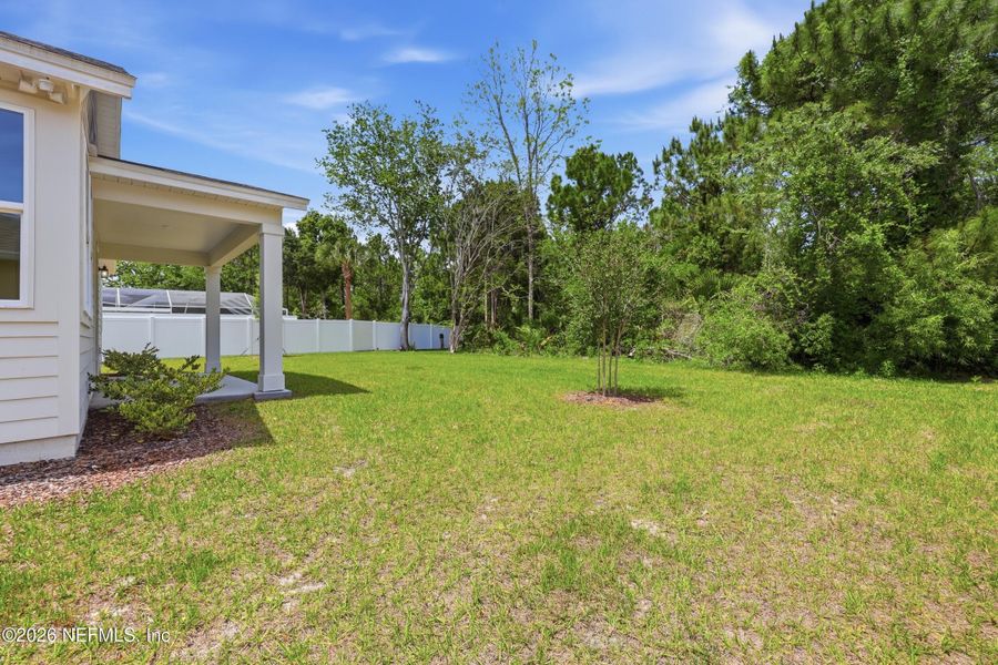 Exterior details and patio area of a home in Palm Coast Homes, Palm Coast (Image 4).