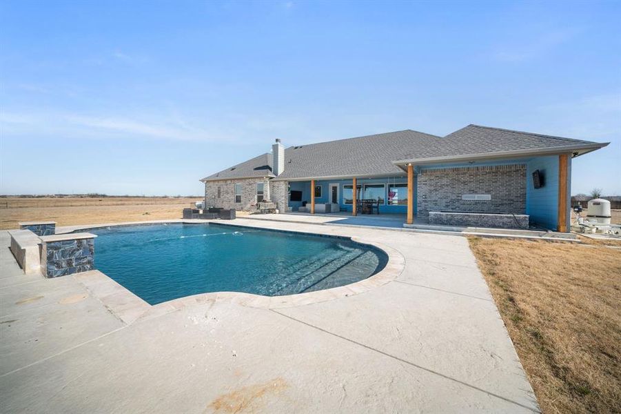 Outdoor pool featuring a patio area