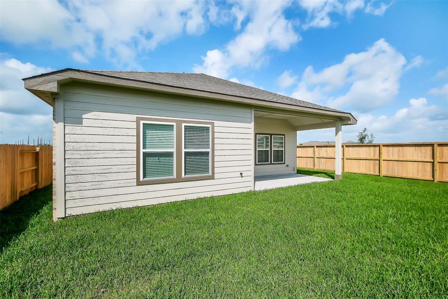 Front exterior of a new home in Emberly, Beasley, TX, highlighting curb appeal (Image 72).