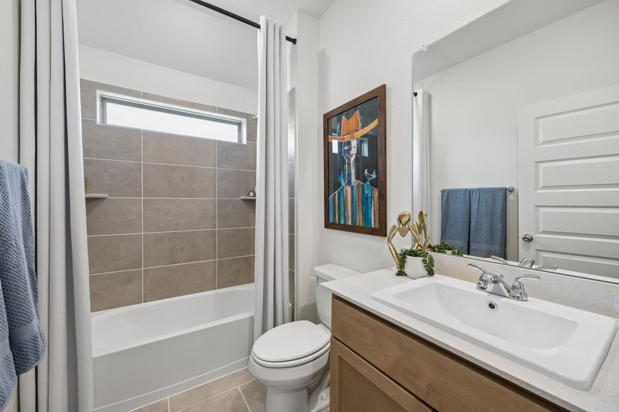 Bathroom in the Pecos home plan by Trophy Signature Homes – REPRESENTATIVE PHOTO