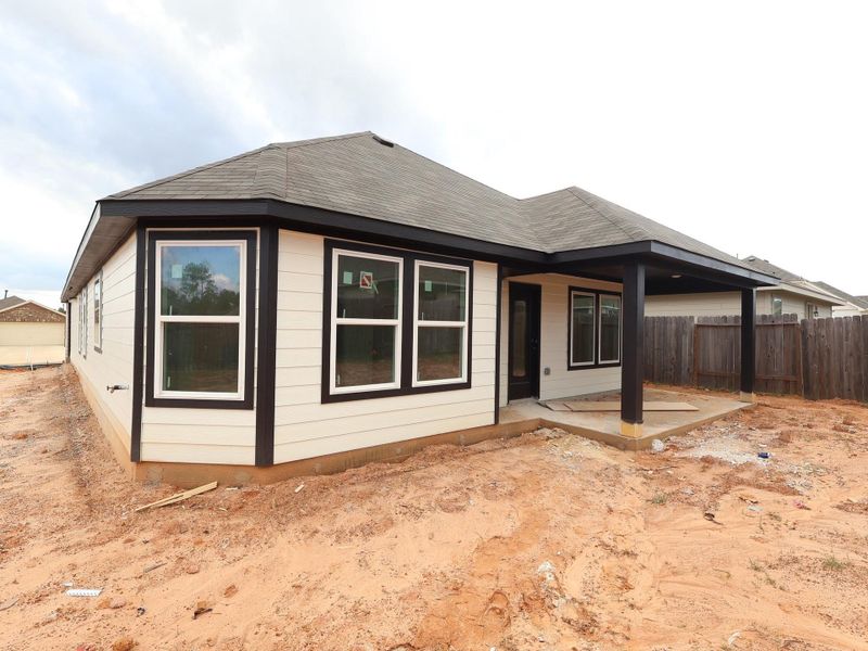 Exterior details and patio area of a home in Magnolia Ridge, Magnolia (Image 17).