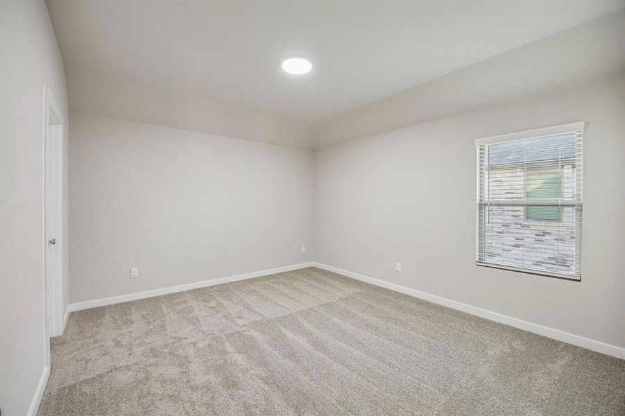 Bedroom in the Wimbledon home plan by Trophy Signature Homes – REPRESENTATIVE PHOTO Bedroom in the Wimbledon home plan by Trophy Signature Homes – REPRESENTATIVE PHOTO