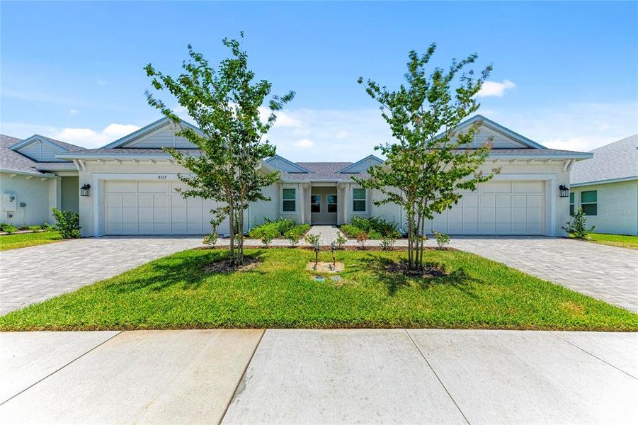 Front exterior of a new home in SeaFlower, Bradenton, FL, highlighting curb appeal (Image 1). Front exterior of a new home in SeaFlower, Bradenton, FL, highlighting curb appeal (Image 1).