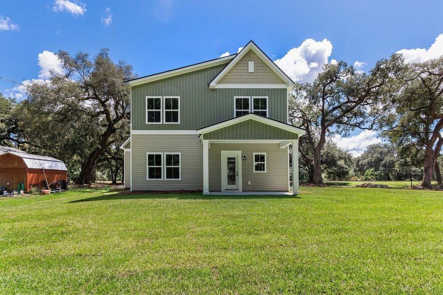 Front exterior of a new home in , Ravenel, SC, highlighting curb appeal (Image 20).