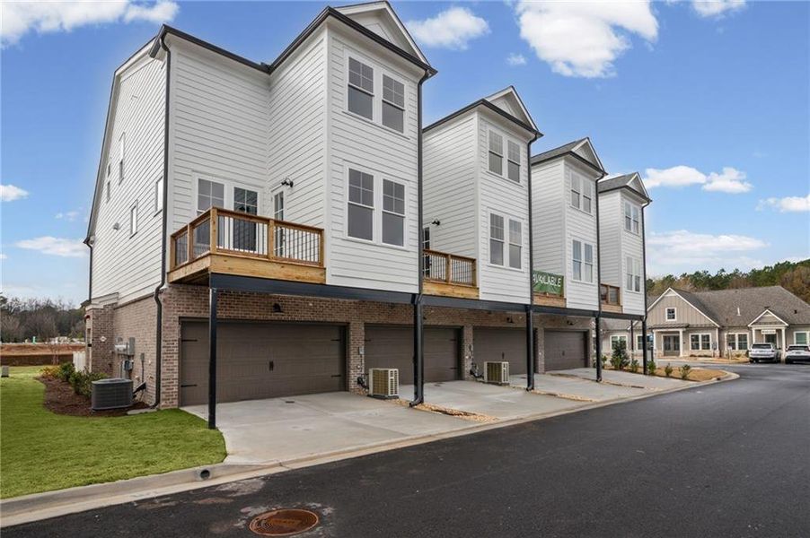 Front exterior of a new home in The Village at River Green, Canton, GA, highlighting curb appeal (Image 21).