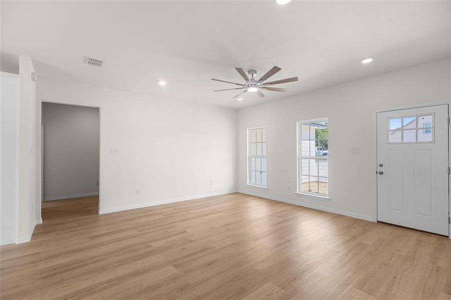 Entrance foyer featuring light wood-style flooring, recessed lighting, and ceiling fan