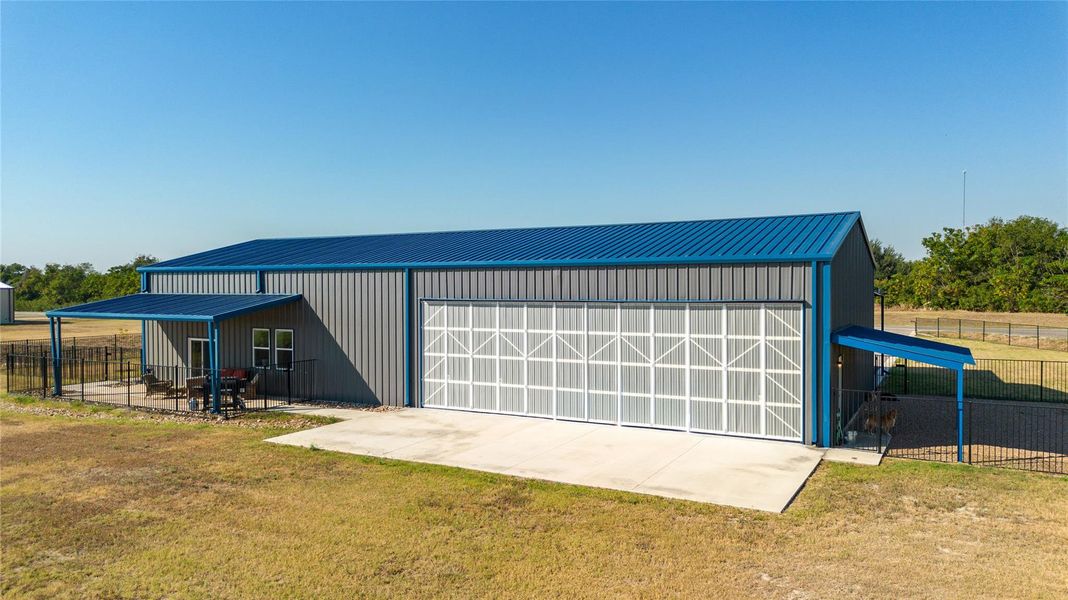Hangar door directly facing the runway for convenient flights from home. Hangar door directly facing the runway for convenient flights from home.