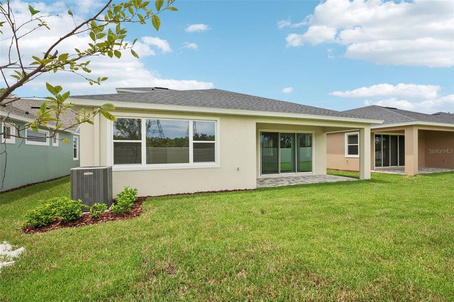 Exterior details and patio area of a home in Primrose at Longleaf, New Port Richey (Image 29).