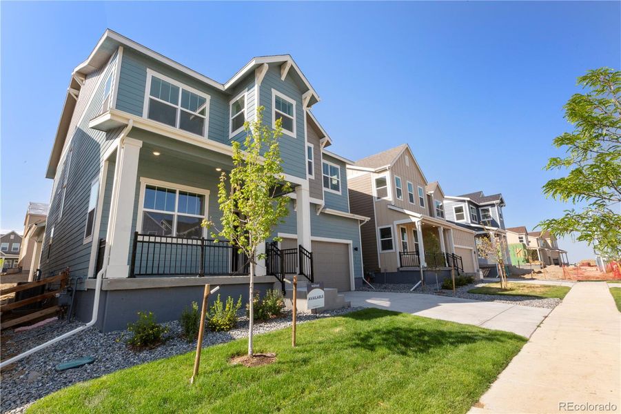 Front exterior of a new home in Dillon Pointe - Journey, Broomfield, CO, highlighting curb appeal (Image 2).
