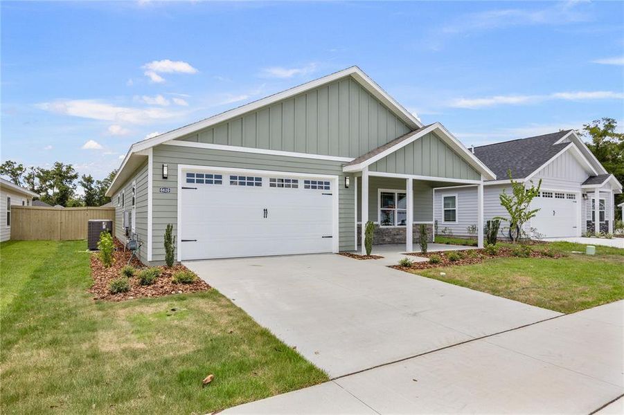 Front exterior of a new home in , Gainesville, FL, highlighting curb appeal (Image 2).