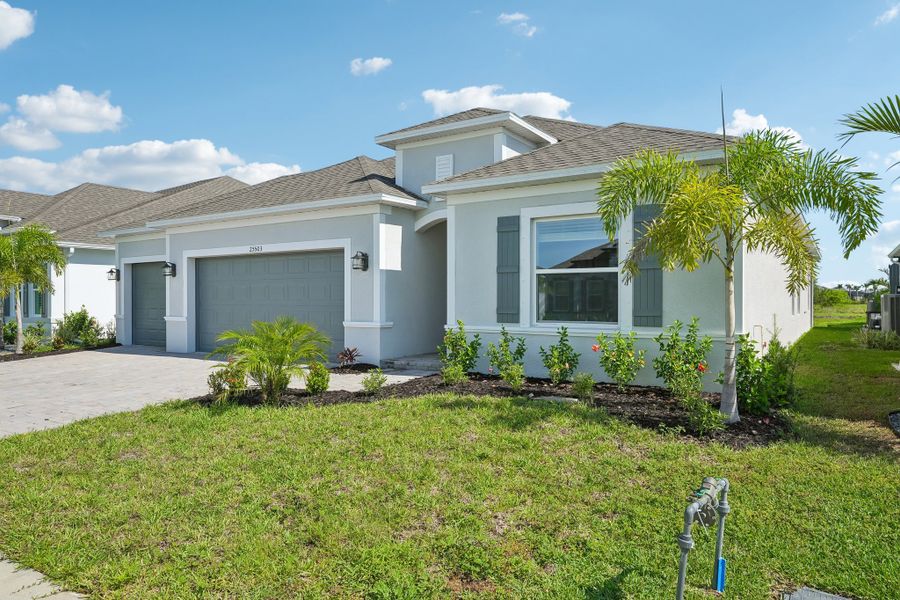 Front exterior of a new home in Heritage Station, Punta Gorda, FL, highlighting curb appeal (Image 29).