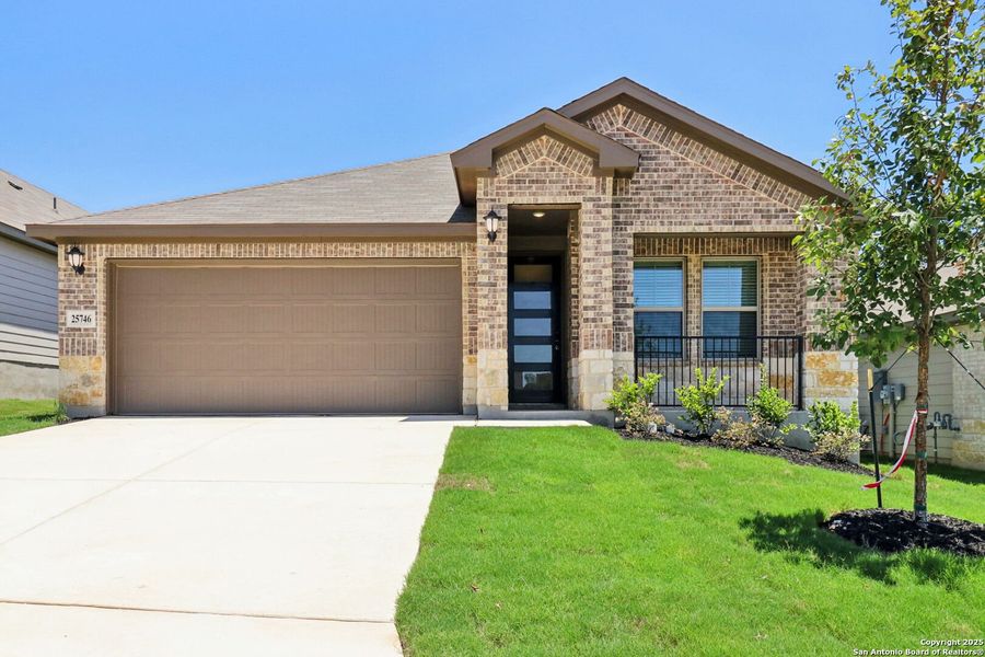 Front exterior of a new home in Scenic Crest - Premier Series, Boerne, TX, highlighting curb appeal (Image 22). Front exterior of a new home in Scenic Crest - Premier Series, Boerne, TX, highlighting curb appeal (Image 22).