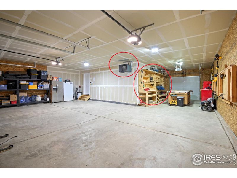 Nearly 1100 sf HEATED and attached, drive through garage! Custom bench and built ins circled are included