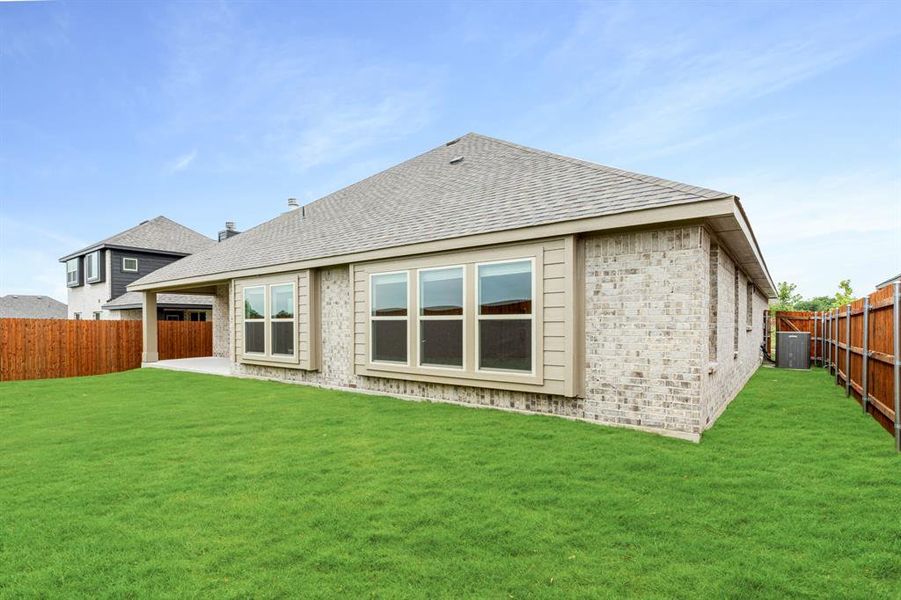 Front exterior of a new home in The Retreat at North Grove 60, Waxahachie, TX, highlighting curb appeal (Image 24). Front exterior of a new home in The Retreat at North Grove 60, Waxahachie, TX, highlighting curb appeal (Image 24).