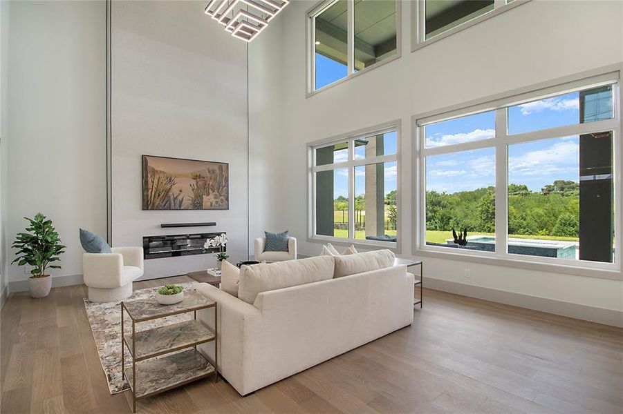 Living room with wood finished floors and a high ceiling