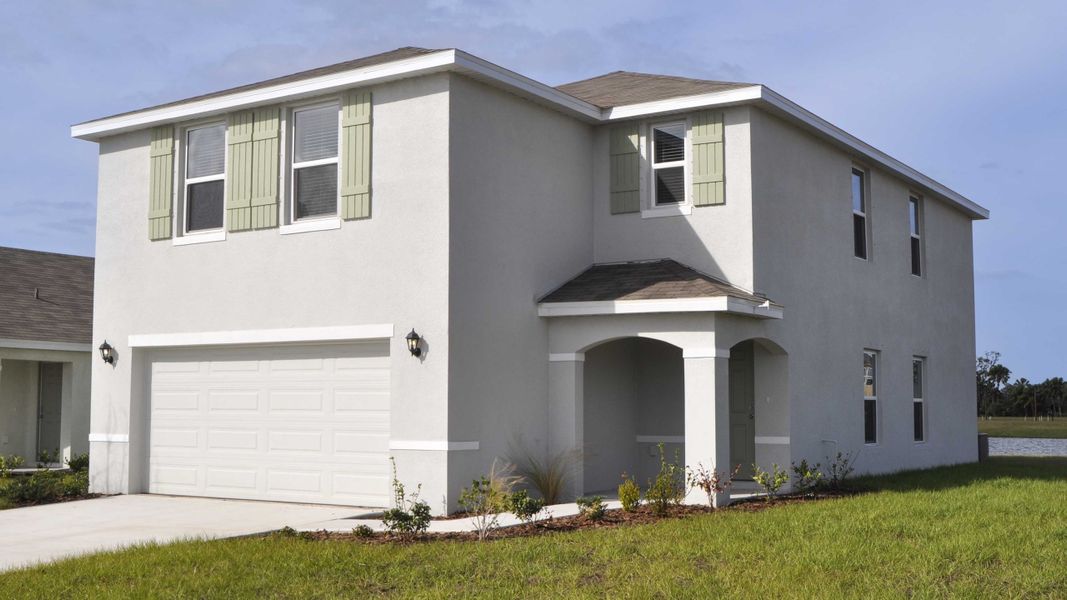 Representative exterior photo of a completed home built from the Elston by D.R. Horton in Oakfield Lakes, Parrish, FL (Image 2). Representative exterior photo of a completed home built from the Elston by D.R. Horton in Oakfield Lakes, Parrish, FL (Image 2).