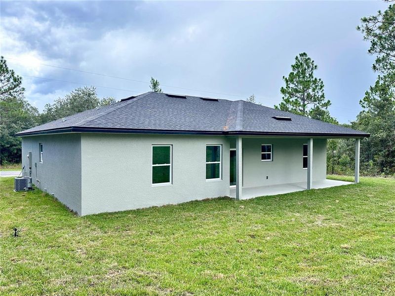 Front exterior of a new home in , Citrus Springs, FL, highlighting curb appeal (Image 17).