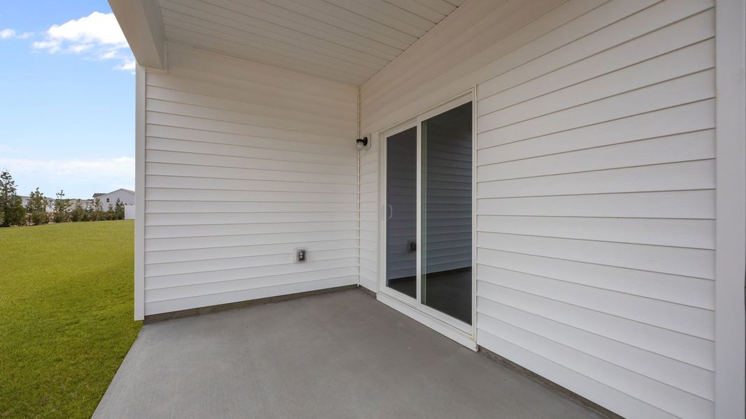 Exterior details and patio area of a home in Ridgewood Farms, Winterville (Image 18).