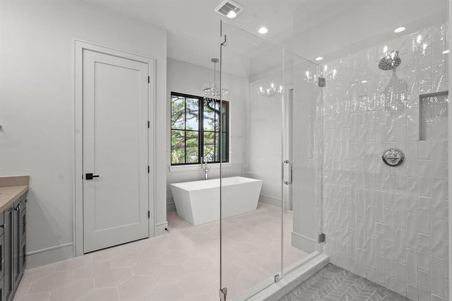 The master bath enjoys double vanities, walk-in shower, soaker tub, and water closet!