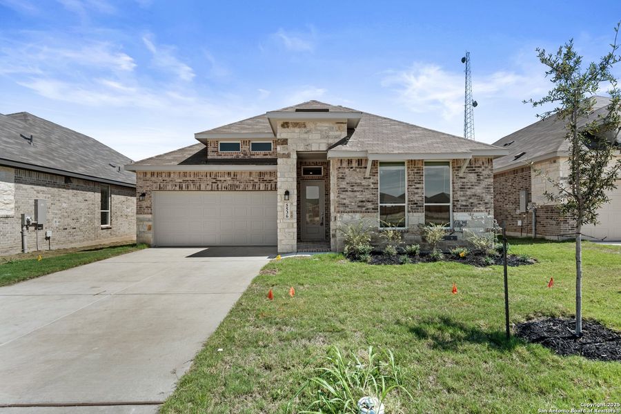 Front exterior of a new home in , New Braunfels, TX, highlighting curb appeal (Image 1). Front exterior of a new home in , New Braunfels, TX, highlighting curb appeal (Image 1).