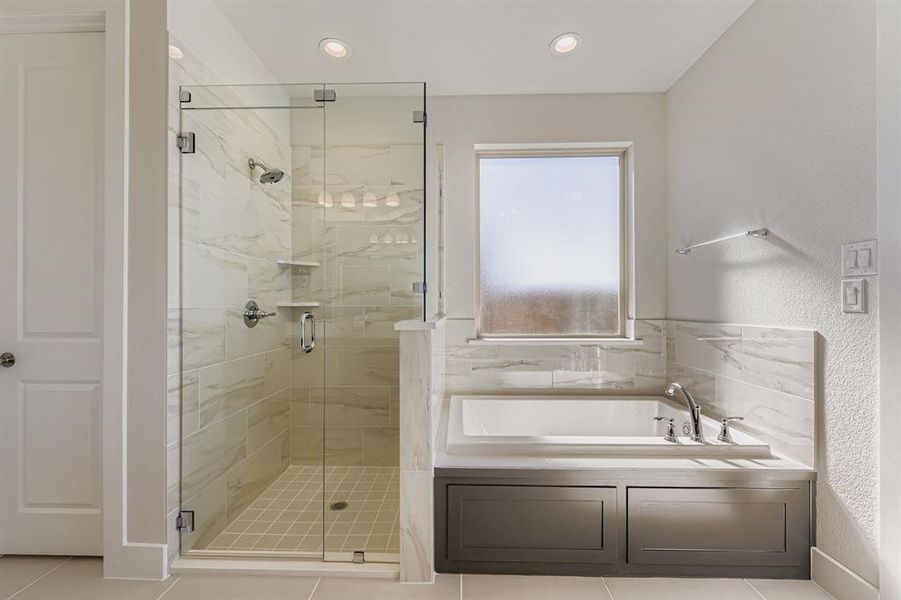 Full bath featuring a garden tub, light tile patterned flooring, a marble finish shower, a textured wall, and recessed lighting