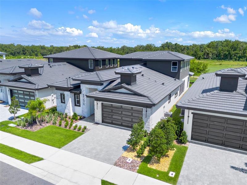Front exterior of a new home in Hampton Green at Providence, Davenport, FL, highlighting curb appeal (Image 30).