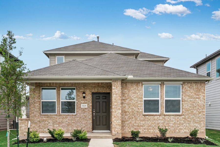 Representative exterior photo of a completed home built from the Pheasant by Taylor Morrison in Emory Crossing, Hutto, TX (Image 12).