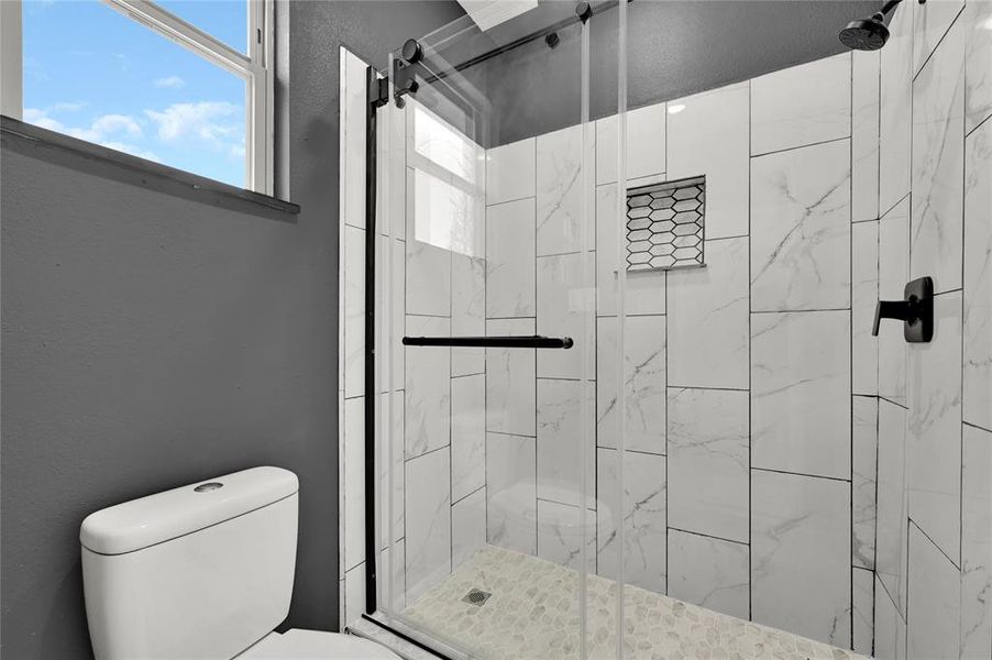 Escape and wash away the stress in this walk-in shower