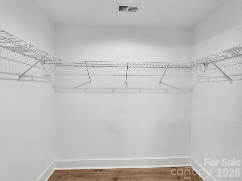 Large walk-in closet in Primary Large walk-in closet in Primary