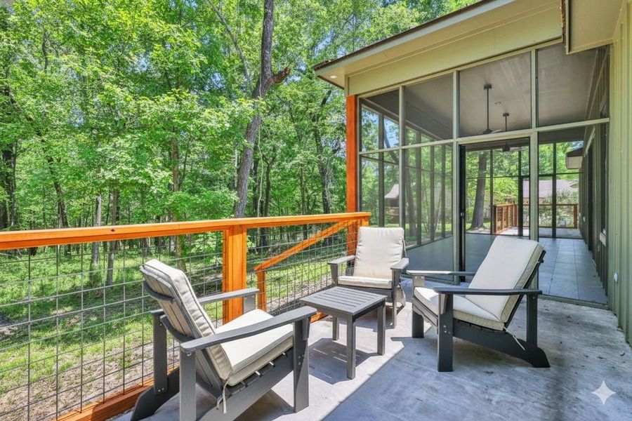 Primary Patio leading to screened in porch - virtually staged