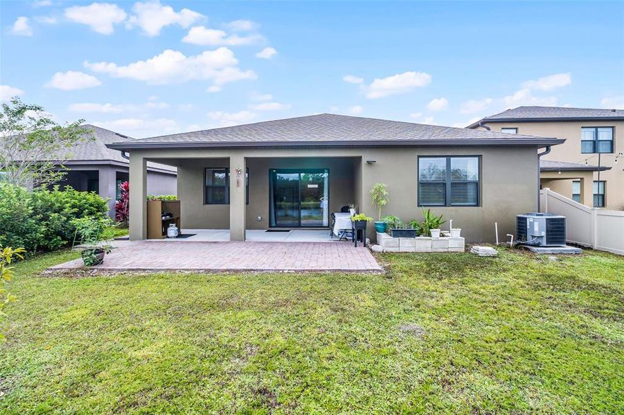 Front exterior of a new home in , Palm Bay, FL, highlighting curb appeal (Image 2).