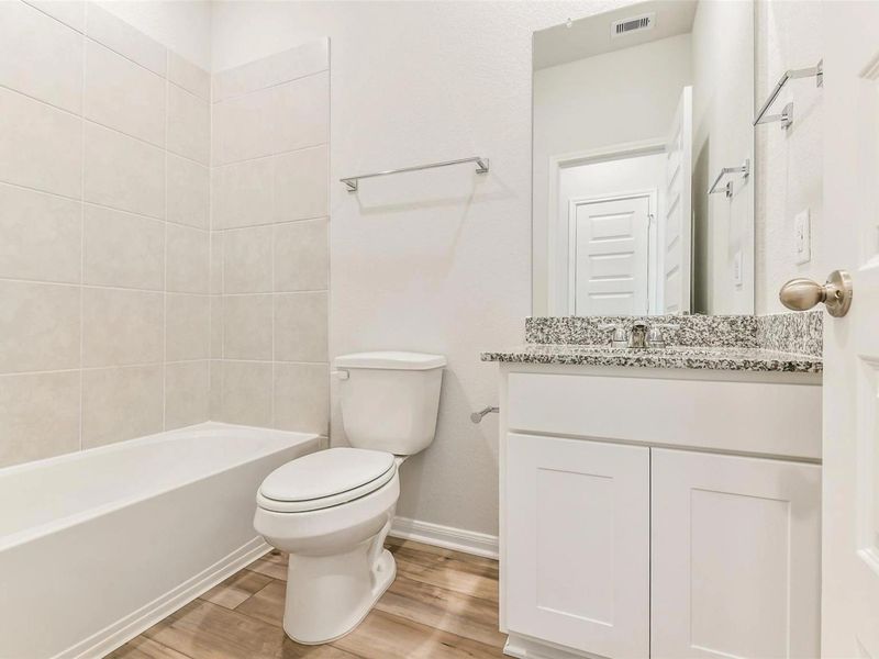 Furnished interior view inside a new home in Caney Creek Place, Conroe (Image 10).