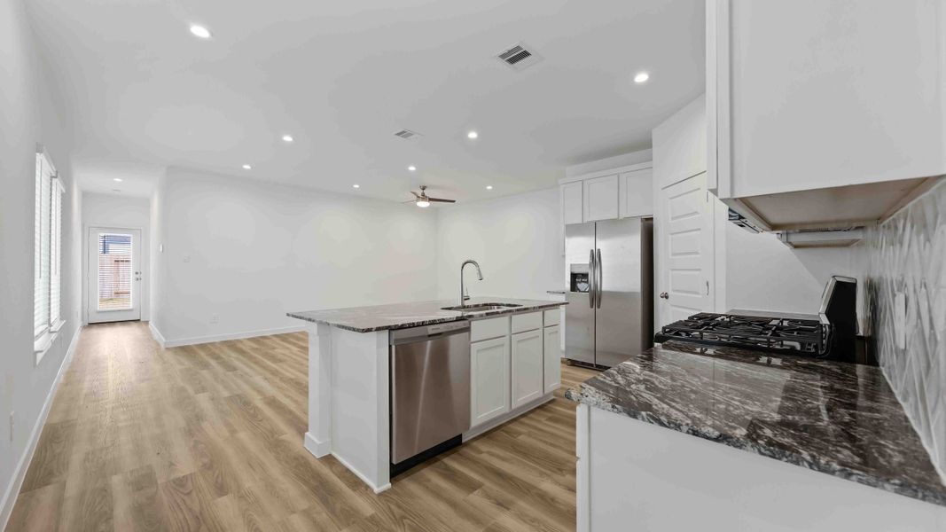 Representative furnished interior of a home built from the Magnolia by D.R. Horton in Grand West, Houston (Image 4).