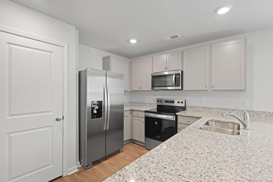 Furnished interior view inside a new home in Pine Hills at Cane Bay, Summerville (Image 8).