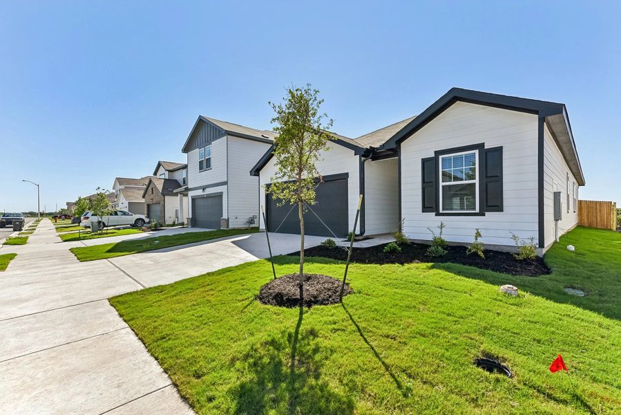 Representative exterior photo of a completed home built from the Prism by Starlight Homes in Castlewood South, Taylor, TX (Image 20). Representative exterior photo of a completed home built from the Prism by Starlight Homes in Castlewood South, Taylor, TX (Image 20).