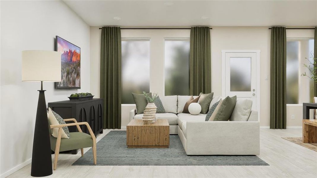 Living area with baseboards and light wood-style flooring